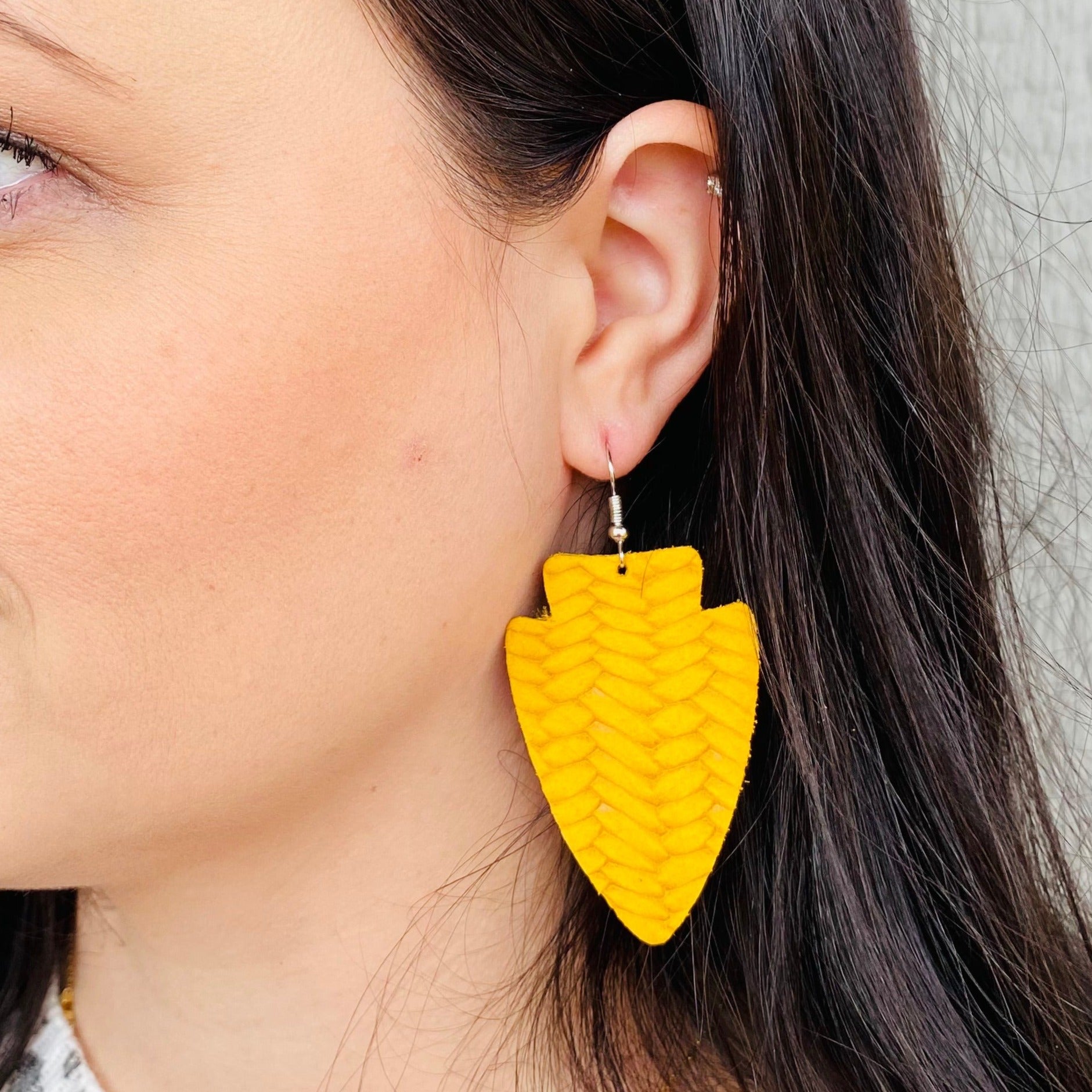 Yellow Braided Leather Kansas City Chiefs Arrowhead Earring on Model